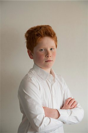 eye contact red hair freckles - Boy with arms folded, portrait Stock Photo - Premium Royalty-Free, Code: 632-08545930