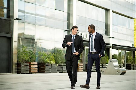 suit (man's) - Business colleagues walking and talking together Stock Photo - Premium Royalty-Free, Code: 632-08698427