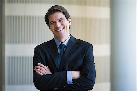 Businessman smiling cheerfully, portrait Photographie de stock - Premium Libres de Droits, Code: 632-08698466