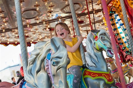 rides at the fair - Little girl riding on carousel Stock Photo - Premium Royalty-Free, Code: 632-08698476