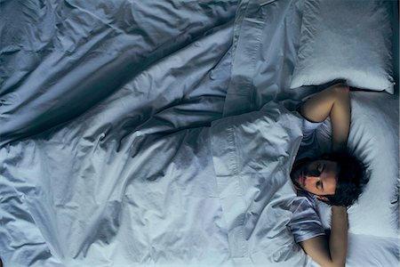 sleeping on bed - Man sleeping in bed Stock Photo - Premium Royalty-Free, Code: 632-08698510