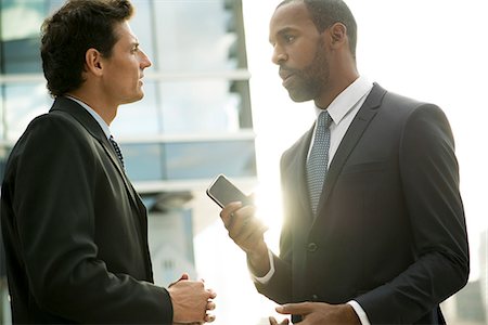 executive and standing and outdoors male - Businessmen talking outdoors Stock Photo - Premium Royalty-Free, Code: 632-08698550