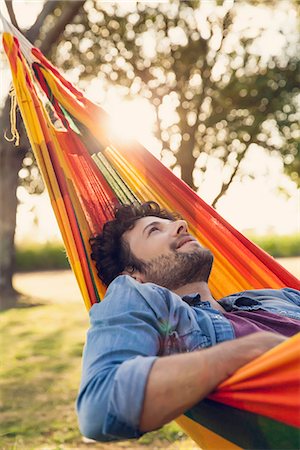 Man relaxing in hammock Stock Photo - Premium Royalty-Free, Code: 632-08698572