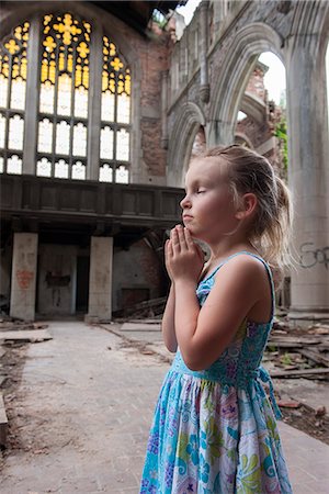 decaying - Little girl praying in ruined church Stock Photo - Premium Royalty-Free, Code: 632-08698636