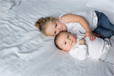 simsearch:632-05760167,k - Little girl cuddling with baby brother Stock Photo - Premium Royalty-Free, Code: 632-08698648