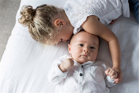 simsearch:632-05760167,k - Little girl cuddling with baby brother Stock Photo - Premium Royalty-Free, Code: 632-08698649