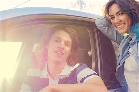 simsearch:633-08639079,k - Woman standing next to man sitting in car Stock Photo - Premium Royalty-Free, Code: 632-08886478