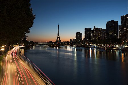 france city at night - Light trails on a street along the River Seine at twilight, Paris, France Stock Photo - Premium Royalty-Free, Code: 632-08886496