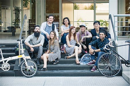 portrait smile 20s asian male - Group of creative colleagues sitting together outdoors Stock Photo - Premium Royalty-Free, Code: 632-08886490