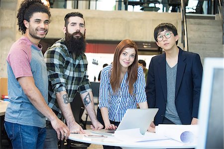 eye contact man portrait - Team of colleagues working together on project in office Stock Photo - Premium Royalty-Free, Code: 632-08886595