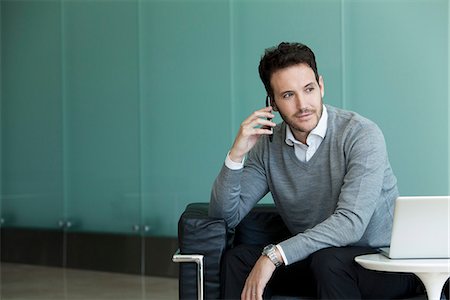 daily life - Businessman using cell phone and laptop computer Stock Photo - Premium Royalty-Free, Code: 632-08886742