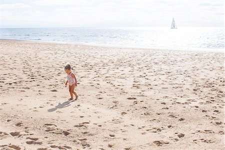 picture little girl swimming suit - Little girl walking on beach Stock Photo - Premium Royalty-Free, Code: 632-08886855