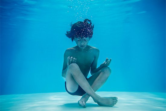 Boy resting in lotus position underwater Stock Photo - Premium Royalty-Free, Image code: 632-08886887