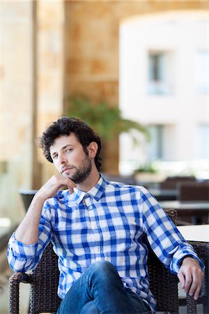 simsearch:649-08894835,k - Man sitting with thoughtful expression on face Stock Photo - Premium Royalty-Free, Code: 632-08886907