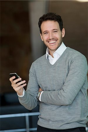 Businessman relaxing with smartphone Stock Photo - Premium Royalty-Free, Code: 632-08887018