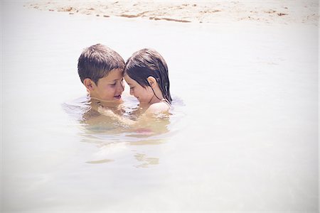 Children playing together in the sea Stock Photo - Premium Royalty-Free, Code: 632-08887071