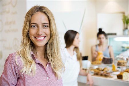 simsearch:632-08886905,k - Young woman smiling cheerfully in small business, portrait Stock Photo - Premium Royalty-Free, Code: 632-08993394