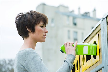 simsearch:632-05817158,k - Woman placing carton in recycling bin Stock Photo - Premium Royalty-Free, Code: 632-08993563