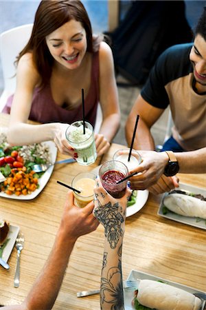 simsearch:632-09039785,k - Friends clinking glasses in restaurant Stock Photo - Premium Royalty-Free, Code: 632-09039782