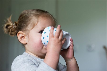 Little girl drinking from cup Stock Photo - Premium Royalty-Free, Code: 632-09039931