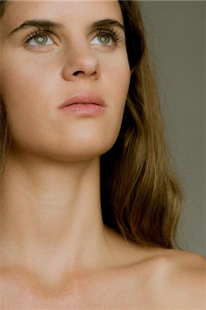 female collar bone photo - Young woman looking up in thought, portrait Stock Photo - Premium Royalty-Free, Code: 632-09039962