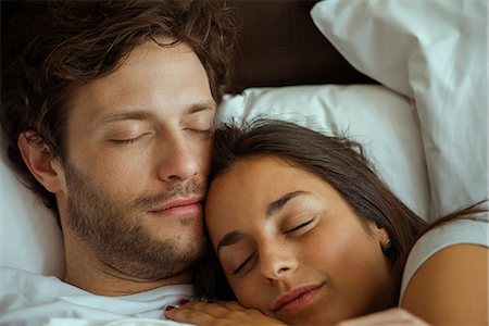 sleeping in female partner hug pic - Couple sleeping in bed Stock Photo - Premium Royalty-Free, Code: 632-09040004