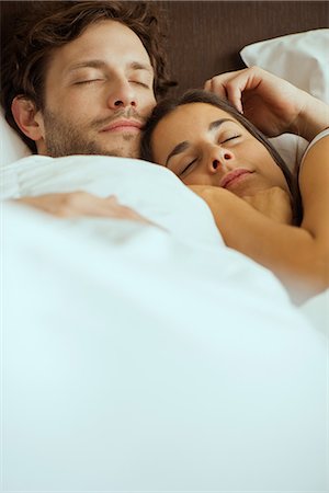 sleeping in female partner hug pic - Couple sleeping in bed Stock Photo - Premium Royalty-Free, Code: 632-09040002