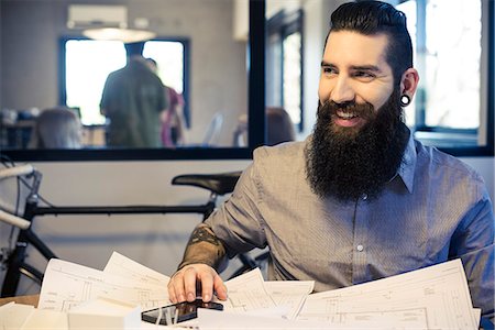 simsearch:622-07743530,k - Architect smiling in office Stock Photo - Premium Royalty-Free, Code: 632-09040080