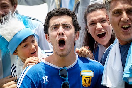 excited sport fan - Argentinian football fans cheering at match Stock Photo - Premium Royalty-Free, Code: 632-09130109