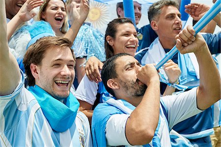 Argentinian football fans watching football match Stock Photo - Premium Royalty-Free, Code: 632-09130112