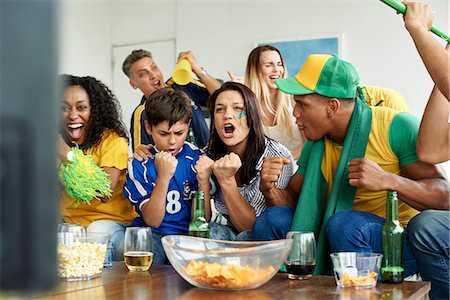 exuberant - Brazilian soccer fans watching televised match together Stock Photo - Premium Royalty-Free, Code: 632-09130175