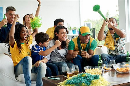 Brazilian soccer fans watching televised match together Stock Photo - Premium Royalty-Free, Code: 632-09130173