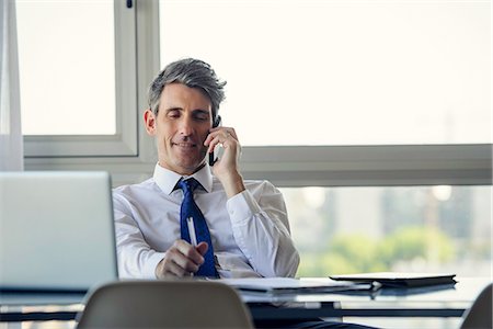 simsearch:614-02680155,k - Man in office talking on phone Stock Photo - Premium Royalty-Free, Code: 632-09140218