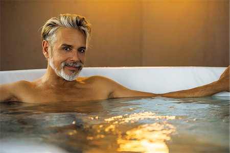 smile relaxed - Man soaking in hot tub Stock Photo - Premium Royalty-Free, Code: 632-09140280