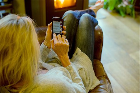 simsearch:632-09140316,k - Woman using smartphone at home Stock Photo - Premium Royalty-Free, Code: 632-09140330