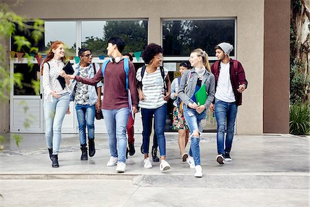 Classmates walking and chatting together on college campus Stock Photo - Premium Royalty-Free, Code: 632-09157960