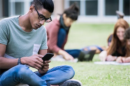 students campus phones - Male college student using smartphone outdoors Stock Photo - Premium Royalty-Free, Code: 632-09157983