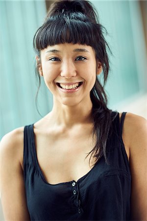 simsearch:632-05992259,k - Young woman smiling cheerfully, portrait Stock Photo - Premium Royalty-Free, Code: 632-09158061