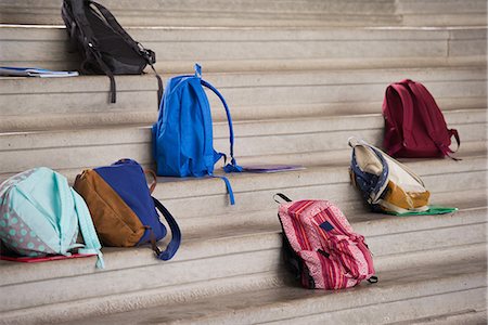 simsearch:400-08264240,k - Backpacks left on bleachers Photographie de stock - Premium Libres de Droits, Code: 632-09158093