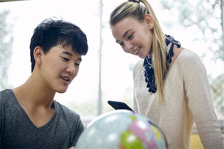 Students looking at globe in class Stock Photo - Premium Royalty-Free, Code: 632-09158126