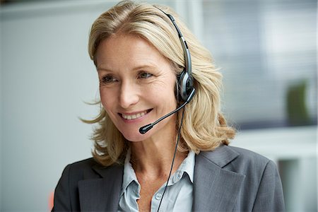 Telecaller with headset Stock Photo - Premium Royalty-Free, Code: 632-09162399