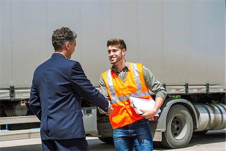 shaking hands on ship - Worker and businessman shaking hands Stock Photo - Premium Royalty-Free, Code: 632-09162527