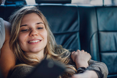 smartphone, car, smiling - Woman taking selfie with smartphone Stock Photo - Premium Royalty-Free, Code: 632-09192241