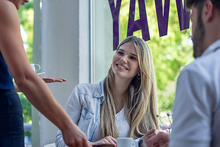 pastries woman cafe - Waitress serving pastry to couple Stock Photo - Premium Royalty-Free, Code: 632-09192322