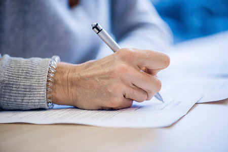 pen on desk - Close-up of businesswoman signing document Stock Photo - Premium Royalty-Free, Code: 632-09192345