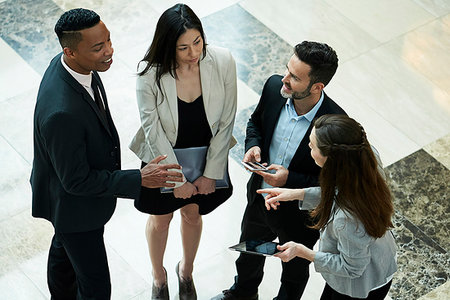 Business people discussing in hotel lobby Stock Photo - Premium Royalty-Free, Code: 632-09254494