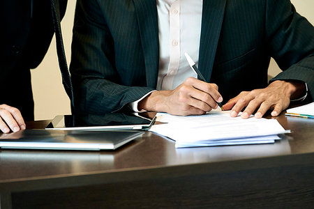simsearch:632-08227744,k - Businessman signing a document in office Stock Photo - Premium Royalty-Free, Code: 632-09254713