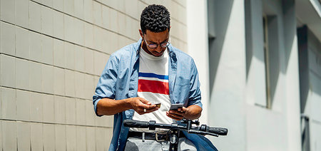 smartphone payment - Young man making online payment with credit card Stock Photo - Premium Royalty-Free, Code: 632-09272890