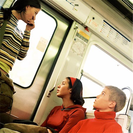simsearch:695-03382568,k - Three teenagers in subway train Fotografie stock - Premium Royalty-Free, Codice: 632-01137061