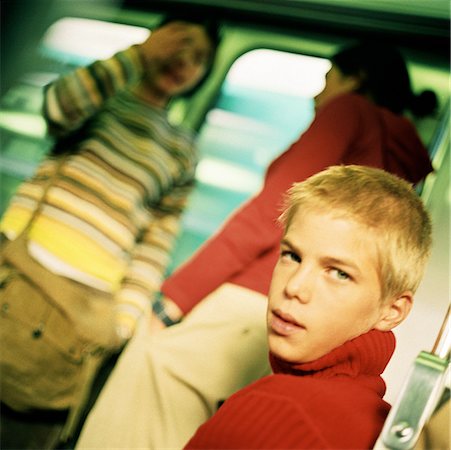 simsearch:695-03382580,k - Teenagers in train, blurred backbround Fotografie stock - Premium Royalty-Free, Codice: 632-01137063